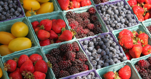 Image of berries and fruit in pints.