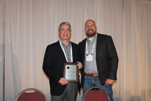 Art Agnello, professor emeritus in Cornell’s Department of Entomology, left, received the Outstanding Extension Educator award from International Fruit Tree Association’s IFPA’s Brett Kast of Kast Farms.