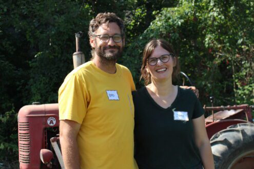 Brad Smith and Jamie Wilbraham in front of tractor.