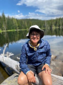 photo of Julie Tarara on a boat by a pond 