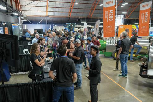 Group of farmers at a trade show.