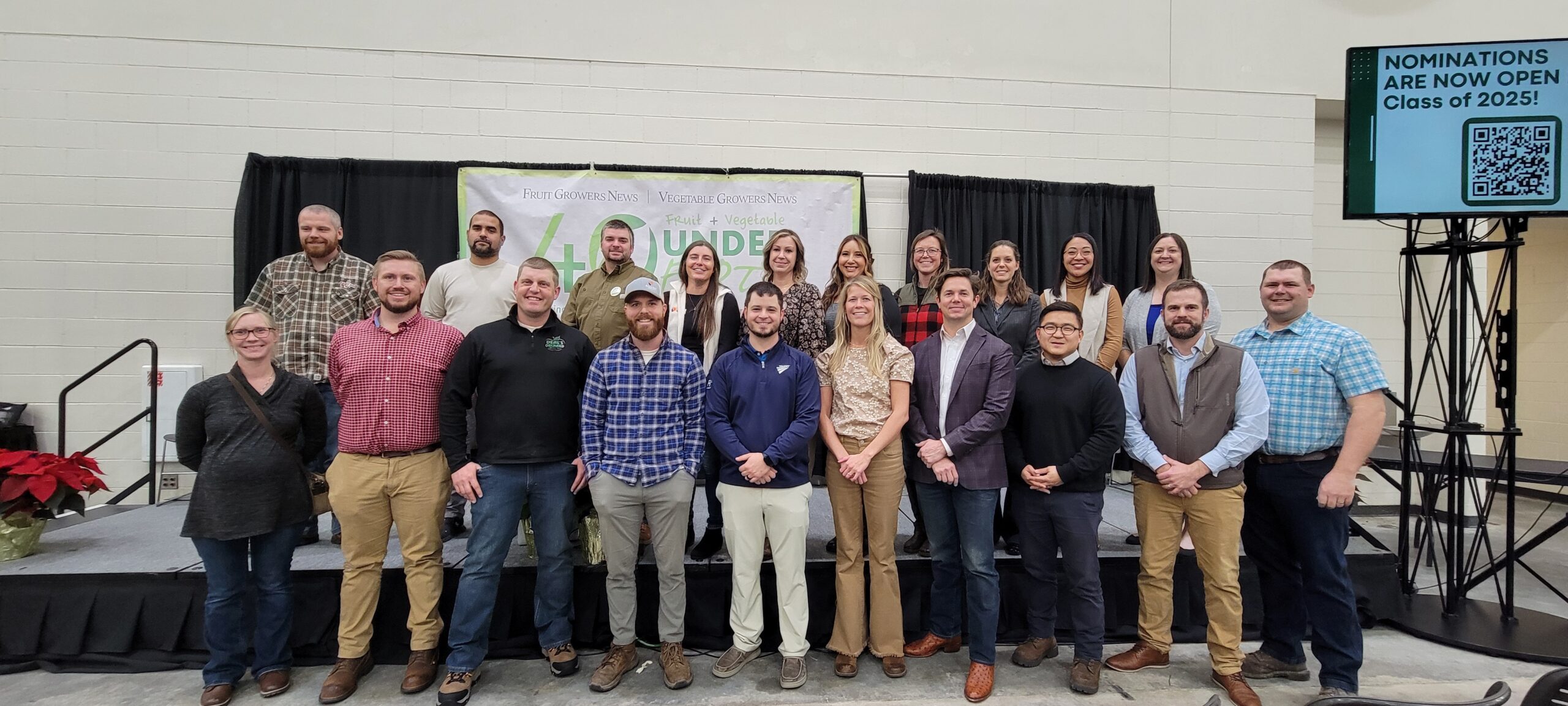 20 adults standing in two rows