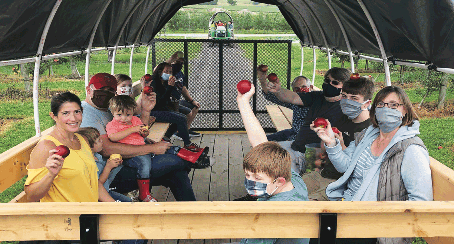 Catoctin Mountain Orchard U-pick customers are transported by wagons