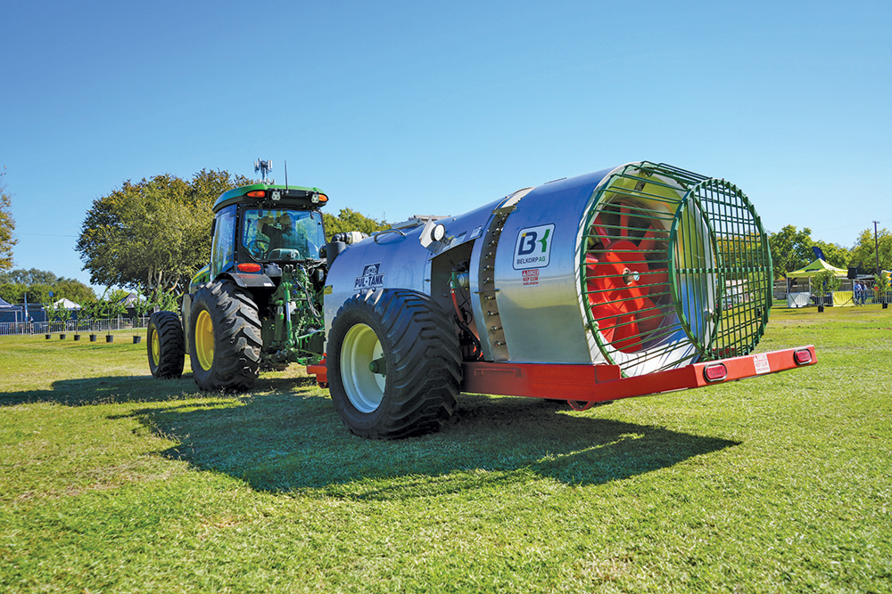 Tractor with large attachment on the back.