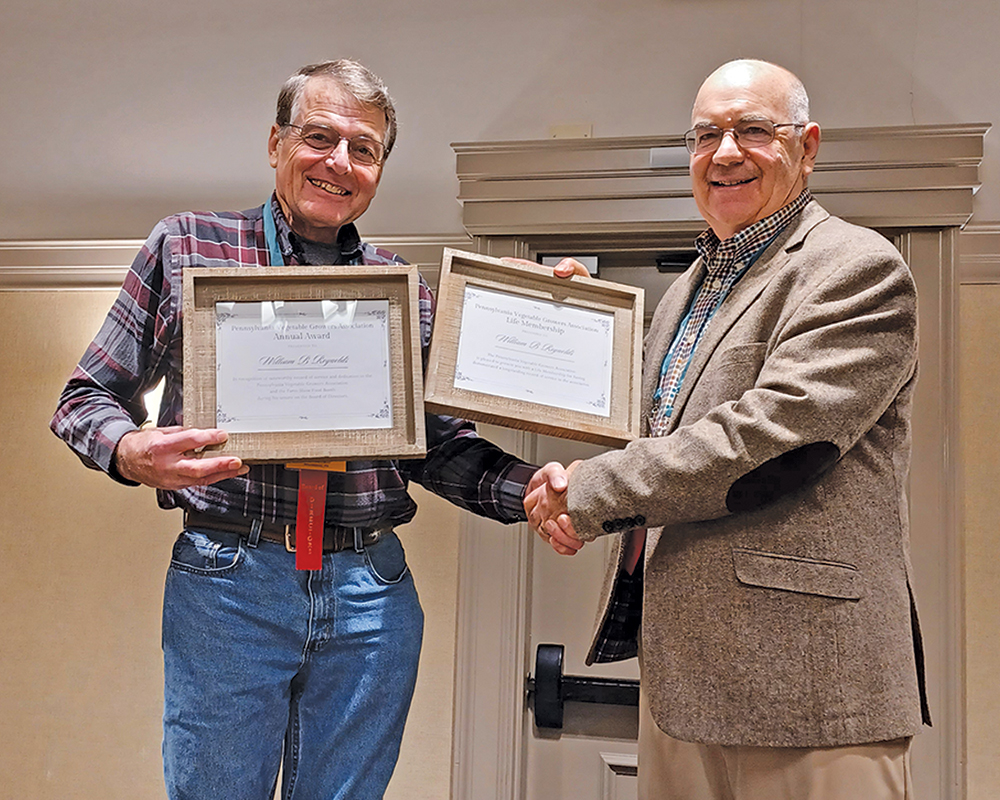 Bill Reynolds, from left, receives the annual and life membership awards from the Pennsylvania Vegetable Growers Association from PFVGA president Peter Flynn at the Mid-Atlantic Fruit & Vegetable Convention. Photo courtesy of PFVGA.