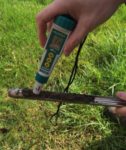A soil pH meter makes it easy to check soil samples in the field.
