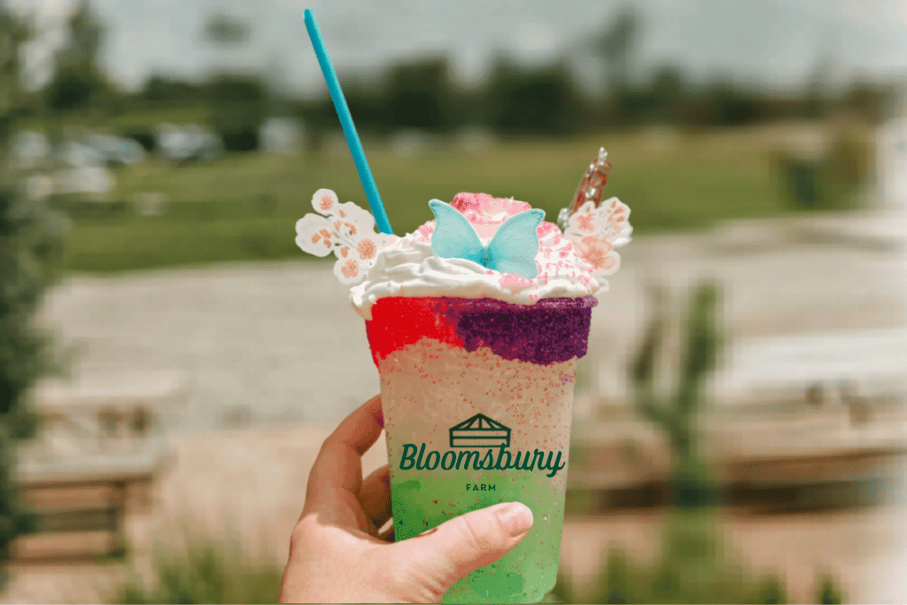 Image of a custom printed cup sample with whipped cream on top of the drink